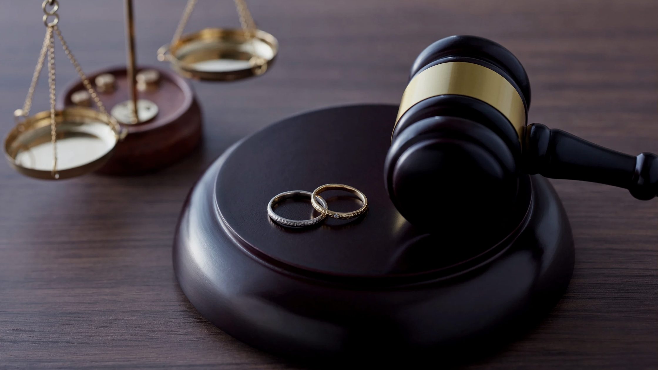 Graphic with a house balanced on scales of justice. Text reads: “How to Value Your Home During Divorce. Not all valuations are created equal.”