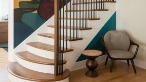 Curved staircase in a Denver luxury home reflecting Art Moderne design style with smooth lines and arched architecture.”
