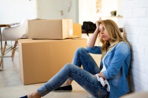 Denver luxury homeowner reflecting on the emotional decision to sell a family home, illustrating how emotional attachment can influence perceived property value and pricing strategy.