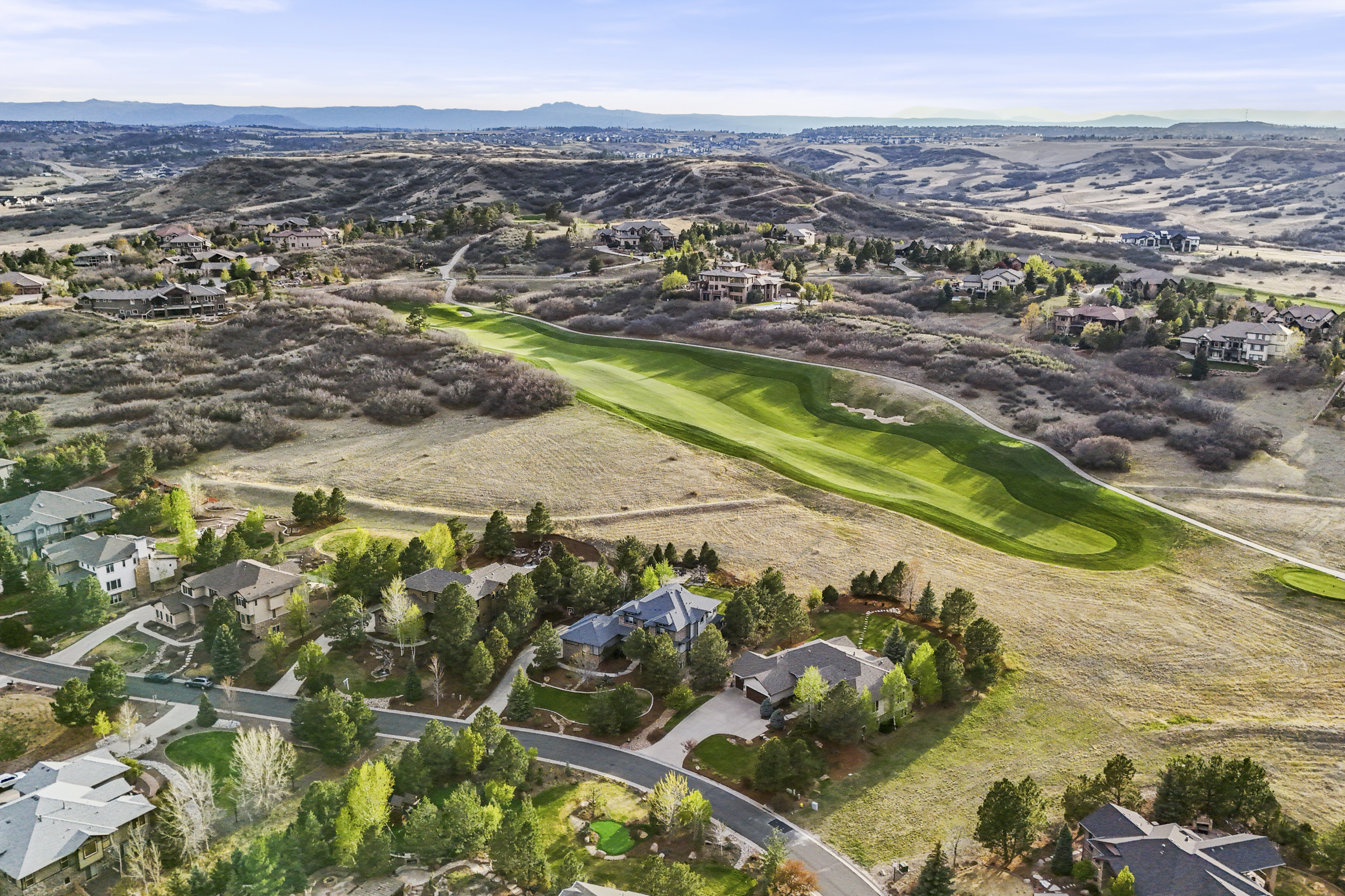 Aerial view of Pradera in Parker, Colorado, showcasing luxury golf course homes, rolling fairways, open space, and the private club lifestyle in Douglas County.